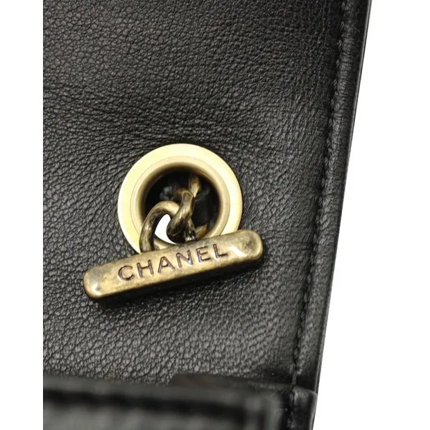 CHANEL Classic Studded Boy Brick Flap Bag in Black Lambskin Leather