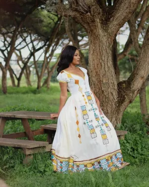 Dazzling Appearance with Ethiopian Traditional Dress: Multicolored Geometrical Patterns on Habesha Dress Beautiful Ethiopian Wedding Dress