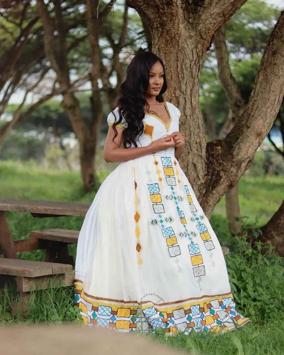 Dazzling Appearance with Ethiopian Traditional Dress: Multicolored Geometrical Patterns on Habesha Dress Beautiful Ethiopian Wedding Dress