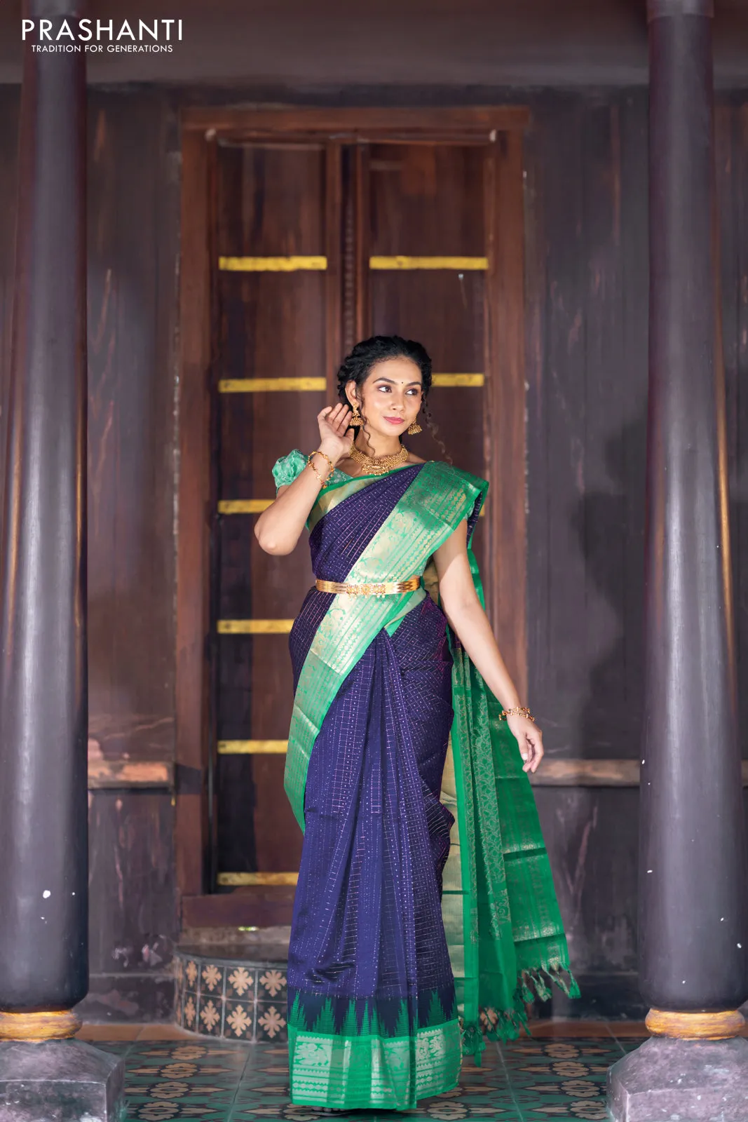 Kuppadam silk cotton saree blue and teal green with allover zari checks & buttas and temple woven elephant design zari border