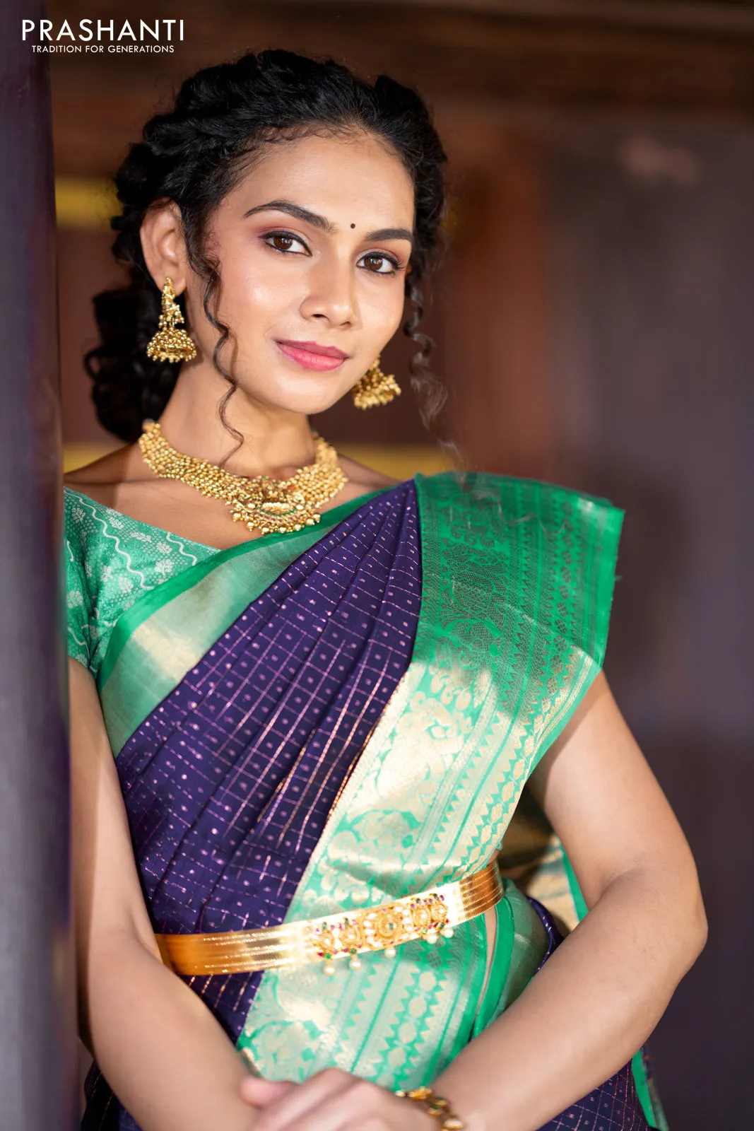 Kuppadam silk cotton saree blue and teal green with allover zari checks & buttas and temple woven elephant design zari border