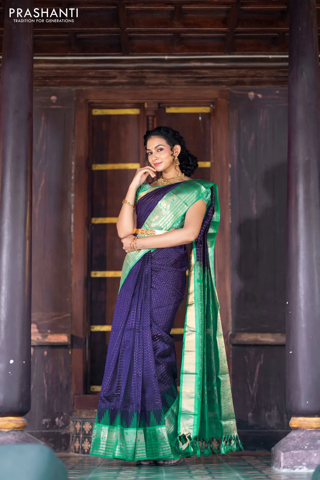 Kuppadam silk cotton saree blue and teal green with allover zari checks & buttas and temple woven elephant design zari border