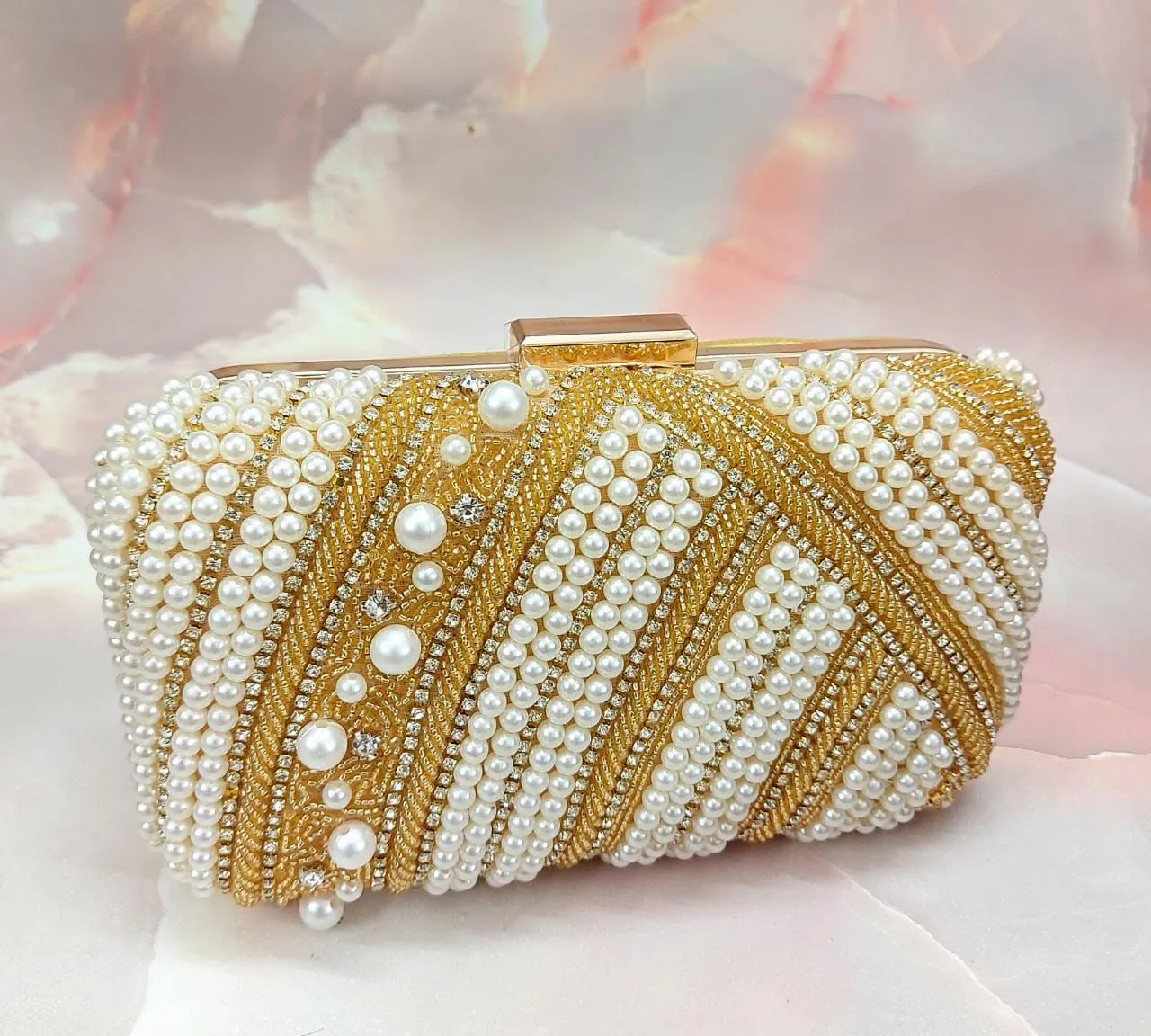 Pearl studded clutch bag